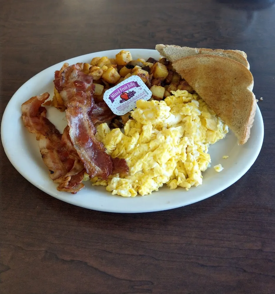 Scrambled Eggs Bacon Home Fries and Toast